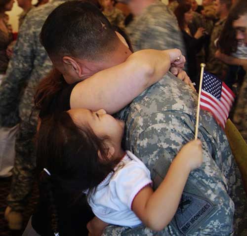 uky_msw_3 Military man holding child
